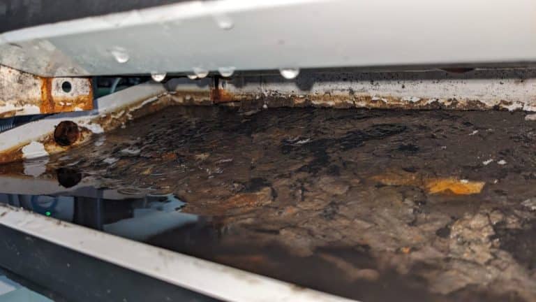 AC leaking water into rusted and dirty drain pan