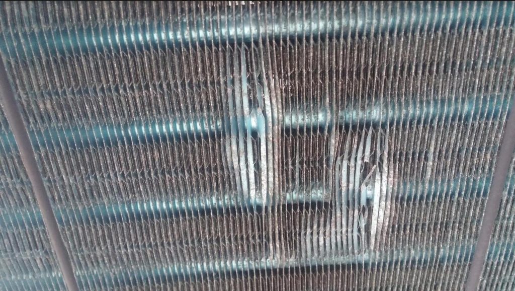 checking dirty condenser coil