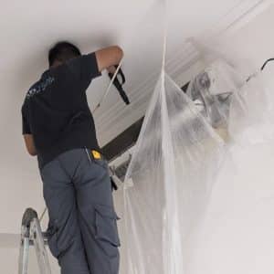 coil cleaning by technician on wall mounted unit