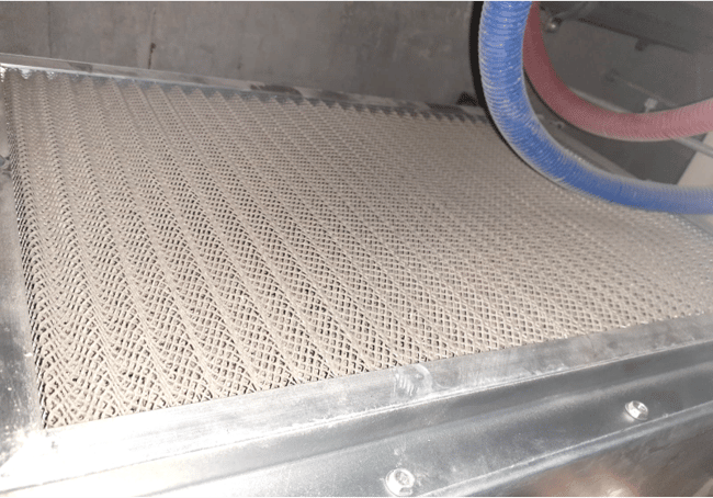 Dusty AC filter fixed to the AC unit before the air conditioning servicing